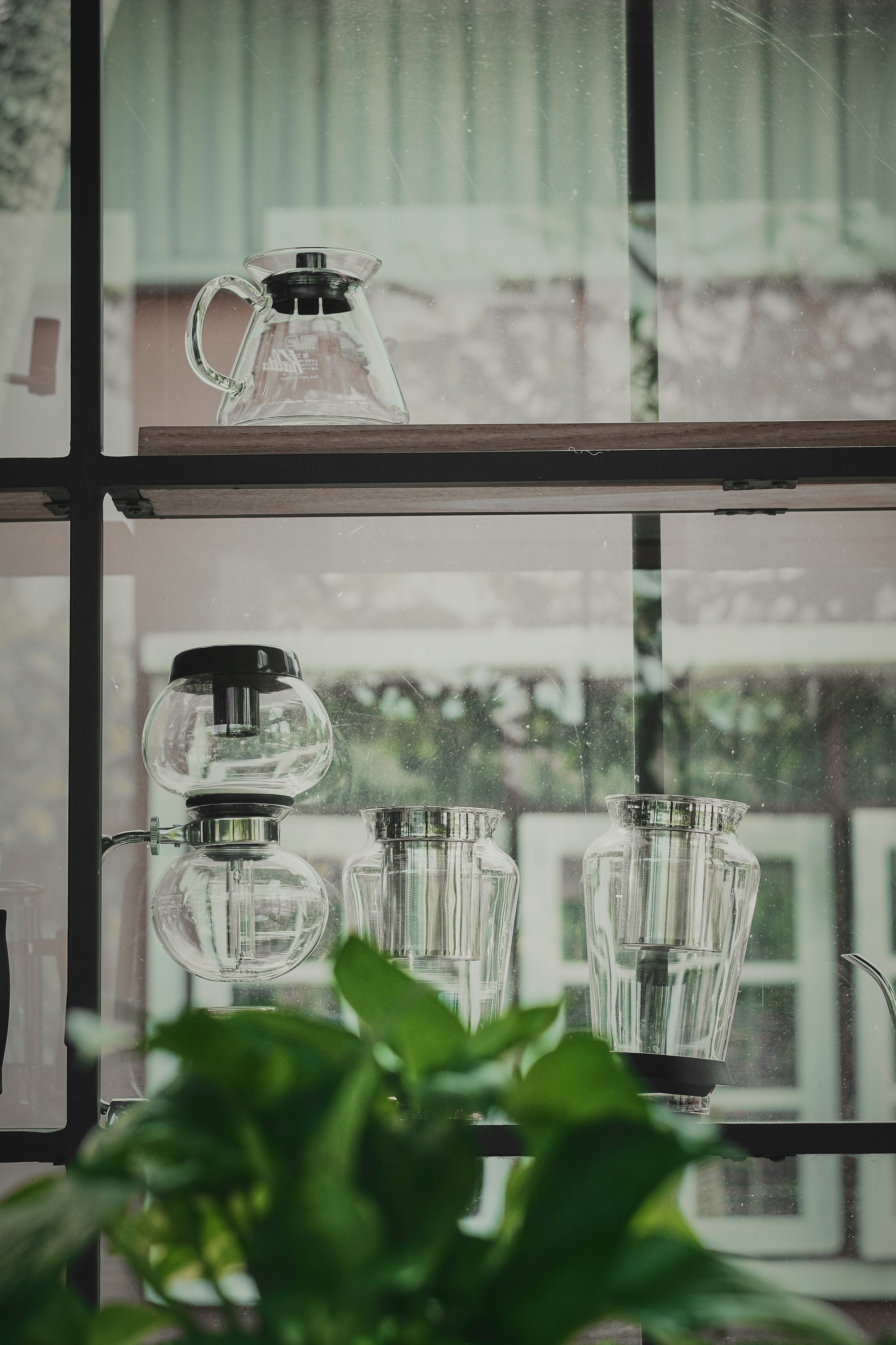 clear glass pitcher on table